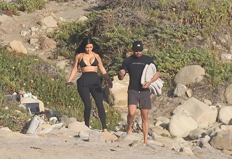 Kim Kardashian and Lewis Hamilton seen KISSING in ocean and can